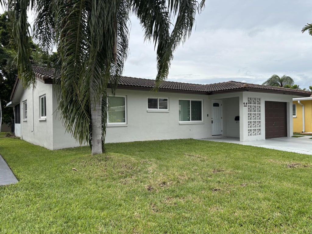 Photo of 5611 NW 49TH Terrace, Tamarac, FL 33319 (MLS # B26079613)