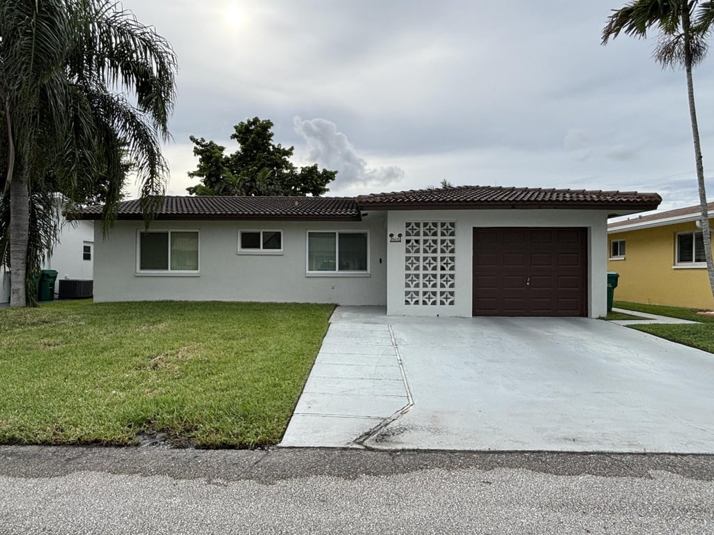 Photo of 5611 NW 49TH Terrace, Tamarac, FL 33319 (MLS # B26079613)