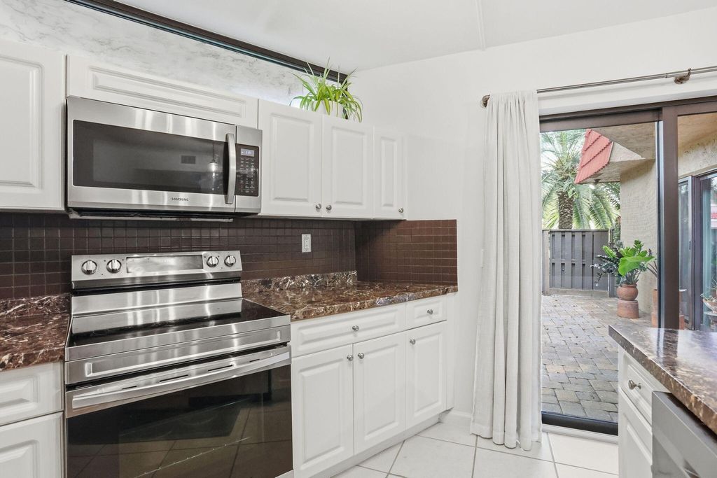 Photo of 8093 Severn Drive #D, Boca Raton, FL 33433 (MLS # B26013411)