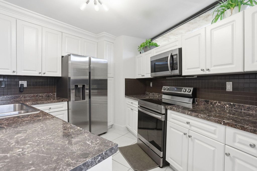 Photo of 8093 Severn Drive #D, Boca Raton, FL 33433 (MLS # B26013411)