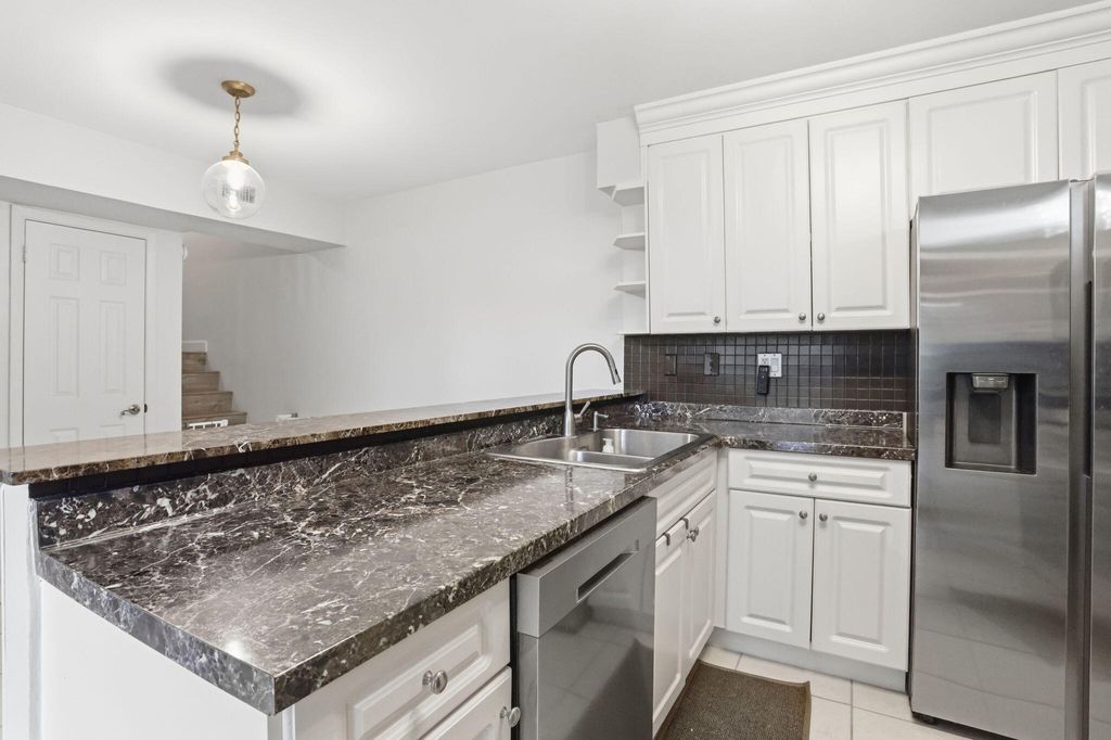 Photo of 8093 Severn Drive #D, Boca Raton, FL 33433 (MLS # B26013411)