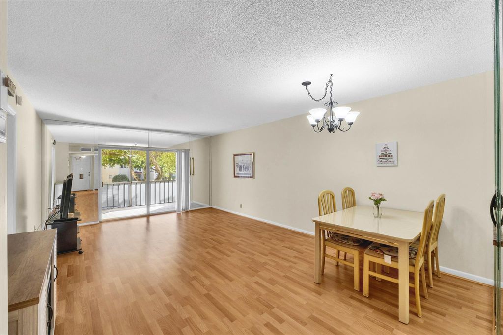 Photo of 1015 Country Club Dr #203, Margate, FL 33063 (MLS # F10532992)