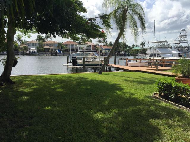 7 residences: main home direct intracoastal + 2 detached cottages & 2 duplexes. Just under 1 acre with 90'+ on intracoastal waterway. 5 boat slips
