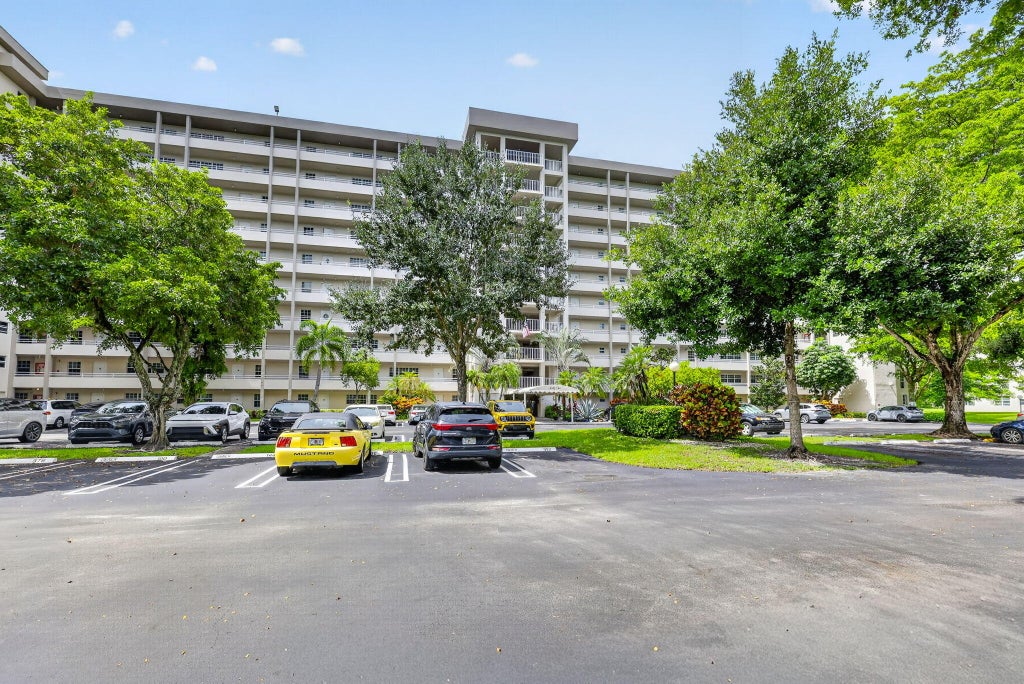 Photo of 575 Oaks Lane #102, Pompano Beach, FL 33069 (MLS # B26080554)