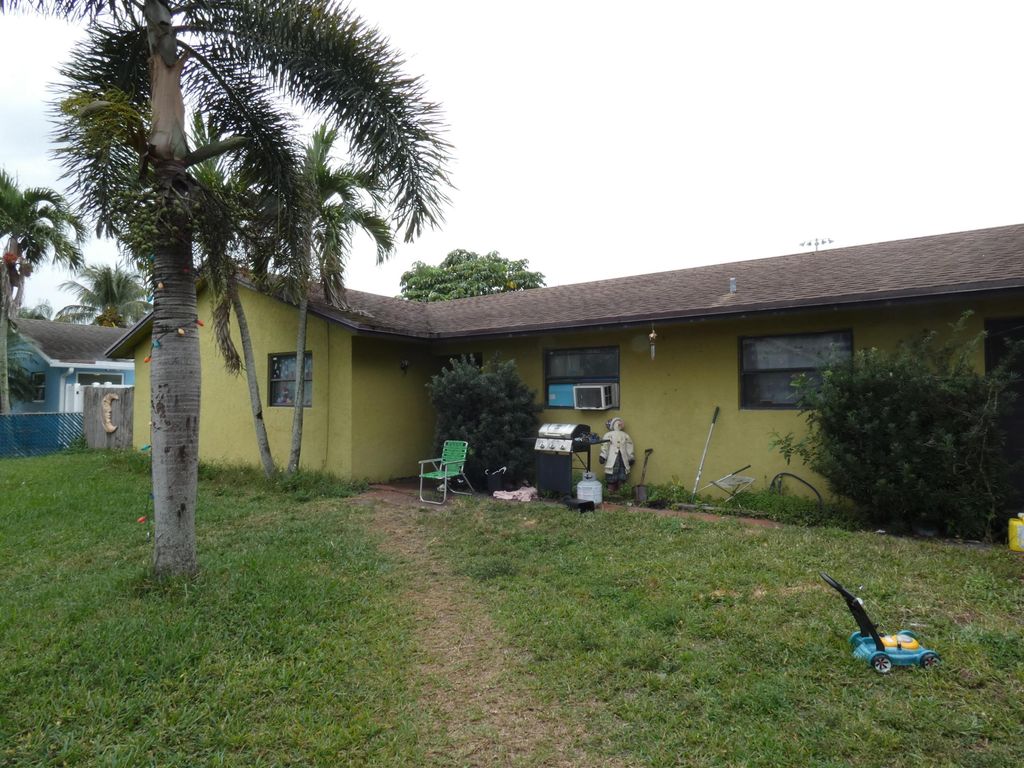 Photo of 6663 Riggers Road, Lake Worth, FL 33462 (MLS # B26022948)