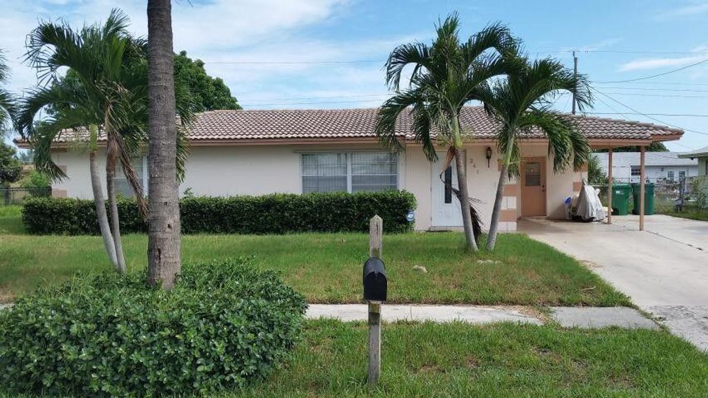 Photo of 341 W 22nd St, West Palm Beach, FL 33404 (MLS # B26000903)