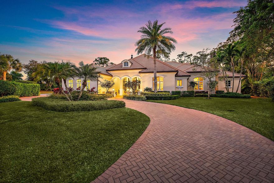 Tucked away within the prestigious, gated golf community of Old Marsh, this custom-built estate is the epitome of luxury and privacy. Located in one of Palm Beach Gardens' most exclusive enclaves, where just 180 custom estates are set on sprawling lots ranging from nearly ½ acre to over 2 acres, this home offers an unparalleled lifestyle. Meticulously crafted by First Florida Construction, this 5-bedroom, 5-bathroom residence is a masterpiece of design and detail. The stately office, adorned with intricate millwork and a stunning fireplace, sets the tone for elegance, while the spacious master suite boasts custom closets and a serene retreat. Three additional ensuite guest suites ensure every visitor enjoys comfort and privacy. The heart of the home is the expansive great room, seamlessly connecting to a chef's kitchen and sunlit breakfast area—all oriented to capture breathtaking views of the lush private preserve. With no neighbors in front or behind, the property offers ultimate seclusion, perfect for intimate gatherings or peaceful relaxation. For the active enthusiast, this estate is just moments from two Har-Tru tennis courts, a playground, and the halfway house. A short golf cart ride brings you to the acclaimed Pete Dye Championship golf course, complete with a state-of-the-art practice facility, learning center, and an intimate clubhouse renowned for its impeccable service. With no tee times required, a renowned caddie program, and an exclusive 275-member club, Old Marsh redefines the golfing experience. Beyond the gates, enjoy quick access to Palm Beach International Airport, world-class dining, luxury shopping, and the turquoise waters of the Atlantic Ocean. This is more than a home—it's a lifestyle. Discover the perfect balance of sophistication, convenience, and tranquility in this extraordinary estate.