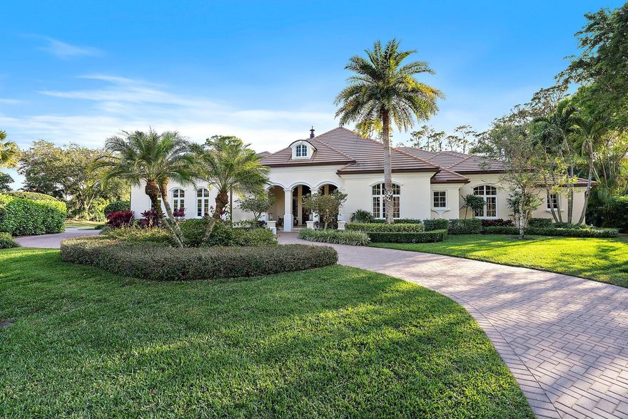 Tucked away within the prestigious, gated golf community of Old Marsh, this custom-built estate is the epitome of luxury and privacy. Located in one of Palm Beach Gardens' most exclusive enclaves, where just 180 custom estates are set on sprawling lots ranging from nearly ½ acre to over 2 acres, this home offers an unparalleled lifestyle. Meticulously crafted by First Florida Construction, this 5-bedroom, 5-bathroom residence is a masterpiece of design and detail. The stately office, adorned with intricate millwork and a stunning fireplace, sets the tone for elegance, while the spacious master suite boasts custom closets and a serene retreat. Three additional ensuite guest suites ensure every visitor enjoys comfort and privacy. The heart of the home is the expansive great room, seamlessly connecting to a chef's kitchen and sunlit breakfast area—all oriented to capture breathtaking views of the lush private preserve. With no neighbors in front or behind, the property offers ultimate seclusion, perfect for intimate gatherings or peaceful relaxation. For the active enthusiast, this estate is just moments from two Har-Tru tennis courts, a playground, and the halfway house. A short golf cart ride brings you to the acclaimed Pete Dye Championship golf course, complete with a state-of-the-art practice facility, learning center, and an intimate clubhouse renowned for its impeccable service. With no tee times required, a renowned caddie program, and an exclusive 275-member club, Old Marsh redefines the golfing experience. Beyond the gates, enjoy quick access to Palm Beach International Airport, world-class dining, luxury shopping, and the turquoise waters of the Atlantic Ocean. This is more than a home—it's a lifestyle. Discover the perfect balance of sophistication, convenience, and tranquility in this extraordinary estate.