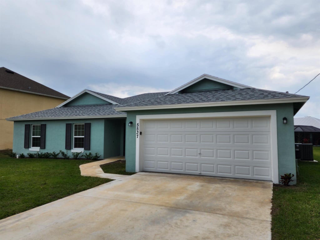 Photo of 5537 NW Burgin Street, Port Saint Lucie, FL 34986 (MLS # R11071681)