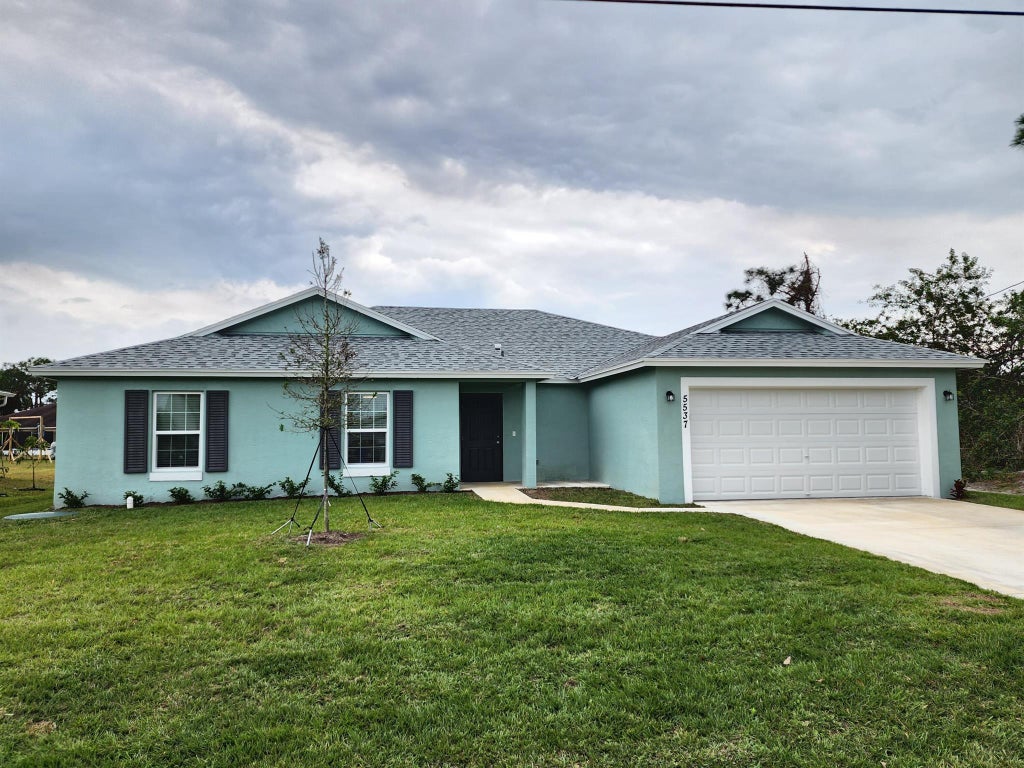 Photo of 5537 NW Burgin Street, Port Saint Lucie, FL 34986 (MLS # R11071681)