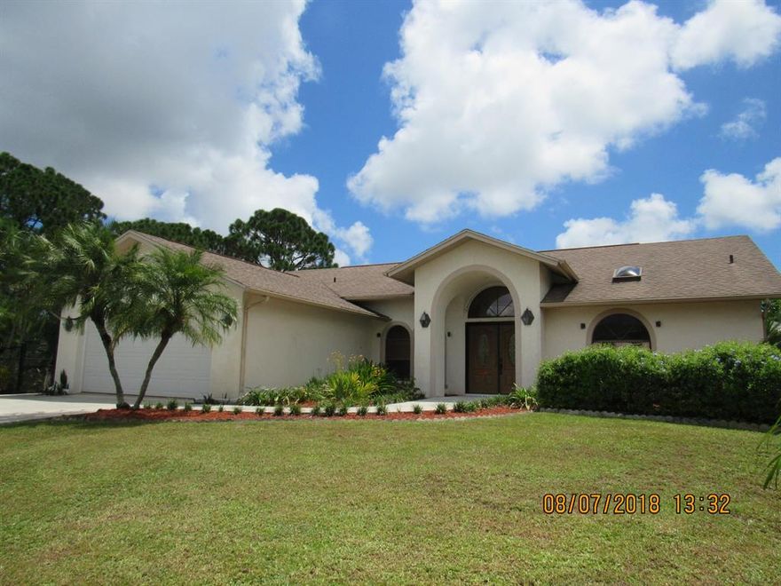 Tell Mom to come on down...What a unique home,  On 2 separate lots, Originally a 3 bedroom which was professional converted to a large 2nd master bedroom, 21/2 bathrooms, a Large screened in pool and spa, a bamboo bar, with pool bath.  A tropical paradise landscaped yard with stone pathways thru 2 plant covered arbors.  Beautiful birds of Paradise, and several fruit trees. .  There is a fence around the house and lot leaving the second lot open landscaped with a shed.. Home features a formal dining room, living room and family room.  Master suite with large master bath area with spa tub sep. shower.  Private Deck off the 2nd master suite for Mom or guests.  Close to 2 parks, golf course, grocery stores, not far from the beach.
