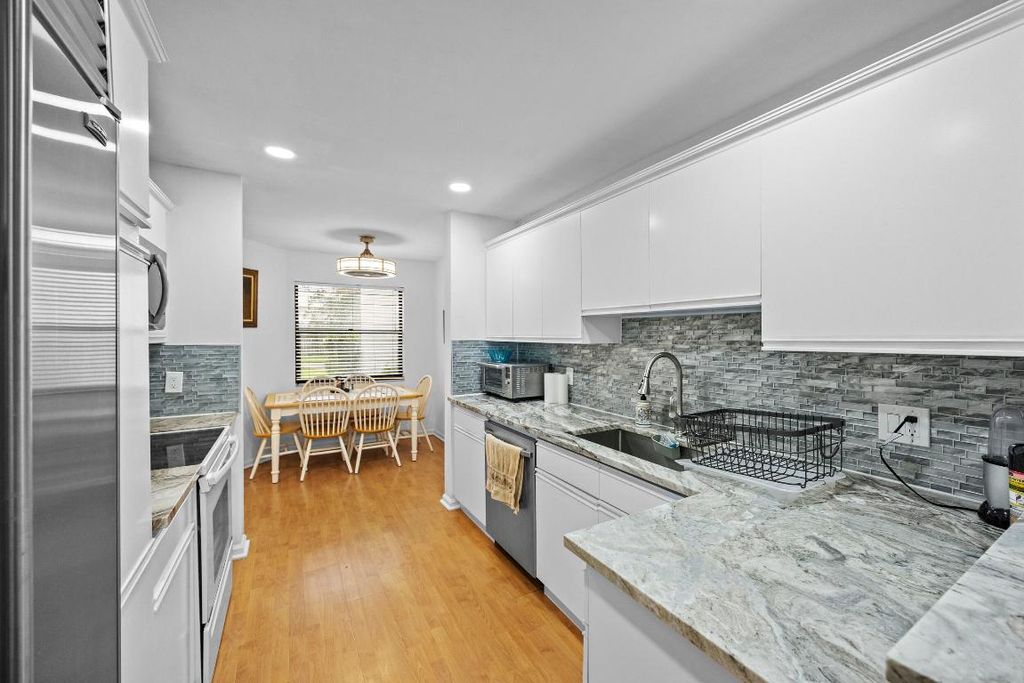 Photo of 1519 Woodbridge Lakes Circle, West Palm Beach, FL 33406 (MLS # R11129839)