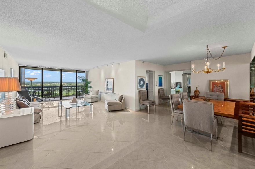 A home ready for TLC, a  residence in the sky to create your own beautiful home with double door entrance. Perfect bones with lots of bonus features including a large Privat storage room across your front door.. Every room has floor to ceiling windows w/ sliding glass doors that bring you on to your 330 ++ SF wrap terrace. This full service de luxe building Is located in a sublime location just minutes from PB Island and PBI Airport. West Palm Beach is truly a booming Mega Center for culture w/ Kravis Ctr, Norton Museum, fine shopping and dining and much much more