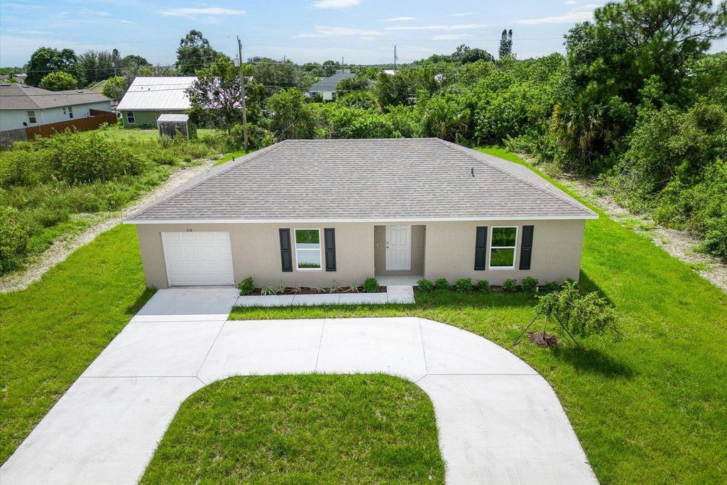 Photo of 316 SW Becker Road, Port Saint Lucie, FL 34953 (MLS # R11027190)