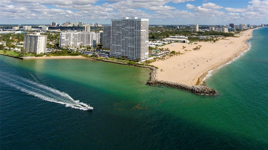 Completely remodeled, DIRECT ocean view, FURNISHED, modern condo on Ft Lauderdale Beach--Stunning South facing remodeled condo offers 180 degrees of spectacular unobstructed panoramic direct ocean, inlet, intracoastal, beach & long coastal views as far as the eye can see from every room. Open kitchen, breakfast bar, Bosch w/d. Master features his/her closets, luxury bath, dual sinks, large shower & pvt water closet. Tile throughout. This is where the ocean & inlet meet...and sparkle like a diamond! Impact Windows/Door. Dynamic views galore: endless boat parade of yachts, mega yachts, submarines. Incredible sunrises/sunsets! Waterfront gym & social rooms, sprawling lawn on inlet, inlet beach, BBQ, putting green & fishing area. Private beach access to the widest part of Ft Lauderdale beach.