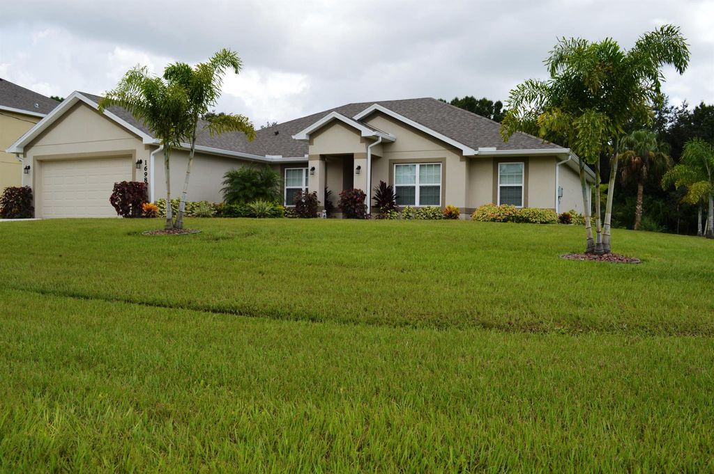 Photo of 1698 SW Ruiz Terrace, Port St Lucie, FL 34953 (MLS # R10902855)
