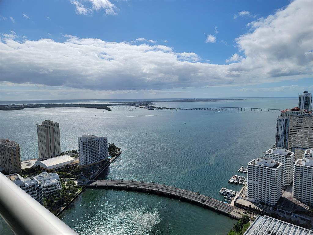 Live in Paradise! This 1 bed/1 bath condo is beautifully and professionally designed and decorated and comes fully furnished with designer furniture. The unit offers incredible high floor bay & city views along with amazing custom finishes. Walk in closet with custom built-ins, en-suite bathroom with double sinks & mirrors. Unit features include: 24X24 white glossy porcelain floors, custom media & storage built-ins, high-end appliances, Lutron custom lighting, nest thermostat, built-in speakers throughout unit + wireless sonos speaker on balcony, built-in functional ethanol fireplace. Water, Basic Cable and Internet included in rent. Building offers: 24hr concierge, valet parking, pool, fitness center, full spa, golf simulator, entertainment room. Walking distance to Brickell City Centre