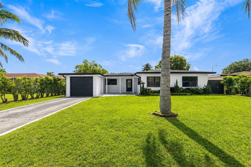 Photo of 24 NW 42nd Terrace, Plantation, FL 33317 (MLS # B26048156)