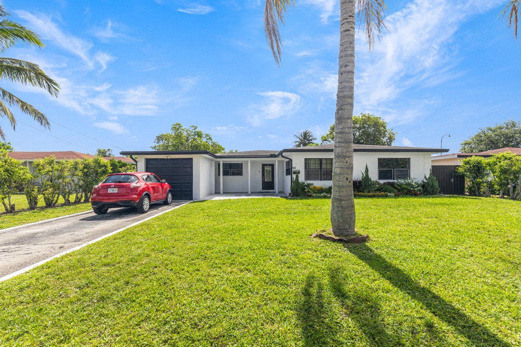 Photo of 24 NW 42nd Terrace, Plantation, FL 33317 (MLS # B26048156)