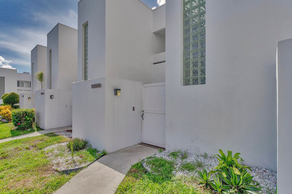 Photo of 5050 Elmhurst Road #D, West Palm Beach, FL 33417 (MLS # B26019582)