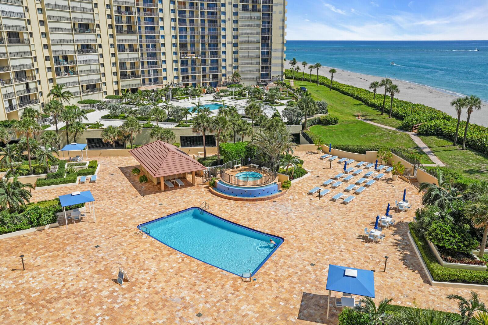 Experience breathtaking ocean views from every room in this exceptional listing. Featuring two bedrooms with a king-sized bed and twin beds, this property is available for seasonal or annual rental. Fully furnished with all the essentials, it offers the convenience of turnkey living. Step outside and enjoy easy access to the neighboring beachfront hotel for dinner and drinks. Take a refreshing dip in the pool located directly on the beach, with no roads to cross. Additionally, take advantage of complimentary amenities including tennis courts, a gym, garage parking, and 24-hour guard gate security for peace of mind.