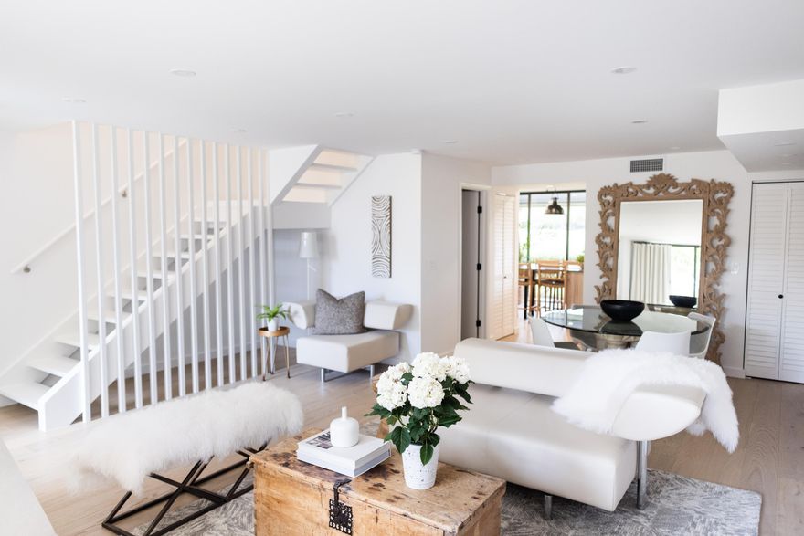 This STYLISHLY RENOVATED 2BR/2.5BA townhome can be yours ABSOLUTELY TURNKEY! Kitchen offers LG appliances, custom cabinetry & Island seating to watch TV above your bar & wine fridge - or enjoy your view of the Fazio course in your backyard. The kitchen is fully set up with everything you could require for entertaining, cooking, & serving. The spacious living/dining area overlooks the thoughtfully landscaped private courtyard. Exceptional Primary Suite has a king bed, bathroom with double sinks, enlarged shower with bench, and large format tiles for a chic modern look. Guest bedroom has 2 double beds, double walk-in closets and a shower/tub combo. White oak floors through the home lend warmth to modern design. This stunning home was remodeled and furnished by Pear Design Build.