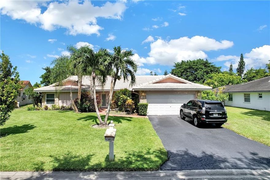 Wonderful, spacious 5 bedroom, 2.5 bath pool home in Coral Springs. The oversized gourmet kitchen is a chef's delight complete with a center cooking island and an abundance of counter space. The kitchen is adjoined by the family room with vaulted ceilings. Formal dining room. Formal living room just inside the front door. Large master suite. The master bath has dual sinks and a large shower. Nice sized bedrooms. IMPACT WINDOWS for peace of mind. Lovely screened patio overlooking the pool. Perfect for morning coffee or just moments of solitude. Oversized sparkling pool with a nice canal waterway behind. Tropical, relaxing setting. Fenced yard. All of this in a location that is convenient to shopping, dining and highway access. Coral Springs offers a bounty of amenities as well. Good schools