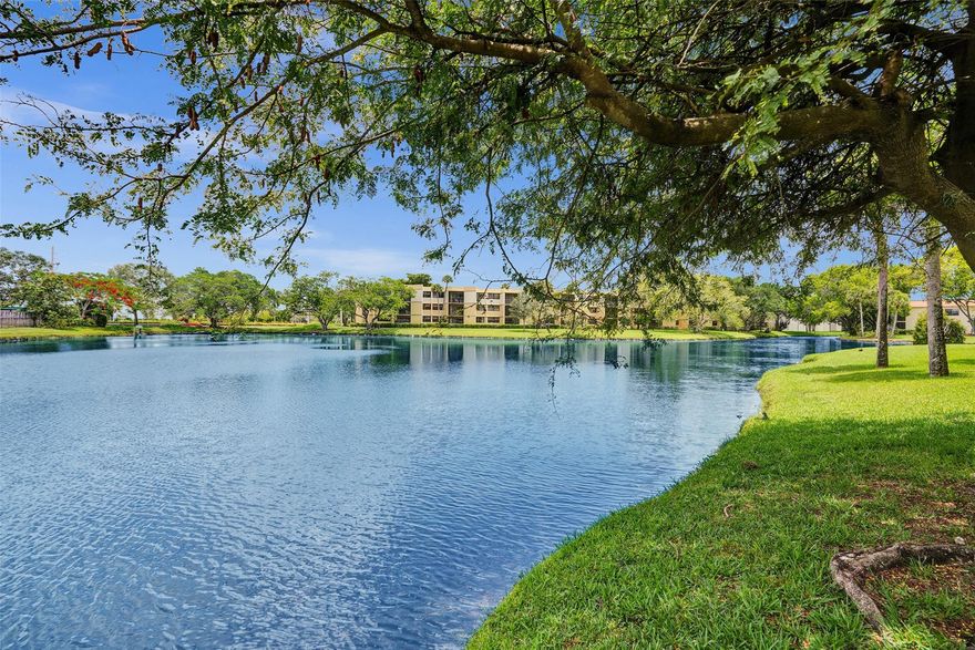 Tired of cookie-cutter condos? This 2-bed 2-bath unit is full of personality, lake views, & just the right touch of “wow.” Sip your morning coffee or evening beverage on 2 screened patios, why settle for one? Open kitchen with stainless steel appliances ready to impress your guests—or at least heat up leftovers in style. Hurricane impact windows & doors for peace of mind, while the bonus storage room gives your stuff a proper home. Reserved parking is right outside, & there's plenty of guest parking when friends drop by (& they will). For the active types— Bonaventure Town Center Club (mandatory membership $375/yr) has you covered. With two pools, gym, tennis courts, indoor basketball, roller skating, bowling, & more. HOA covers water, internet, cable, sewer,  trash. AC 2024