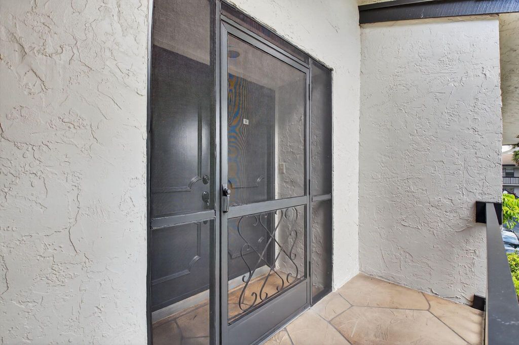 Photo of 5791 Spindle Palm Ct #Unit D, Delray Beach, FL 33484 (MLS # R11102213)