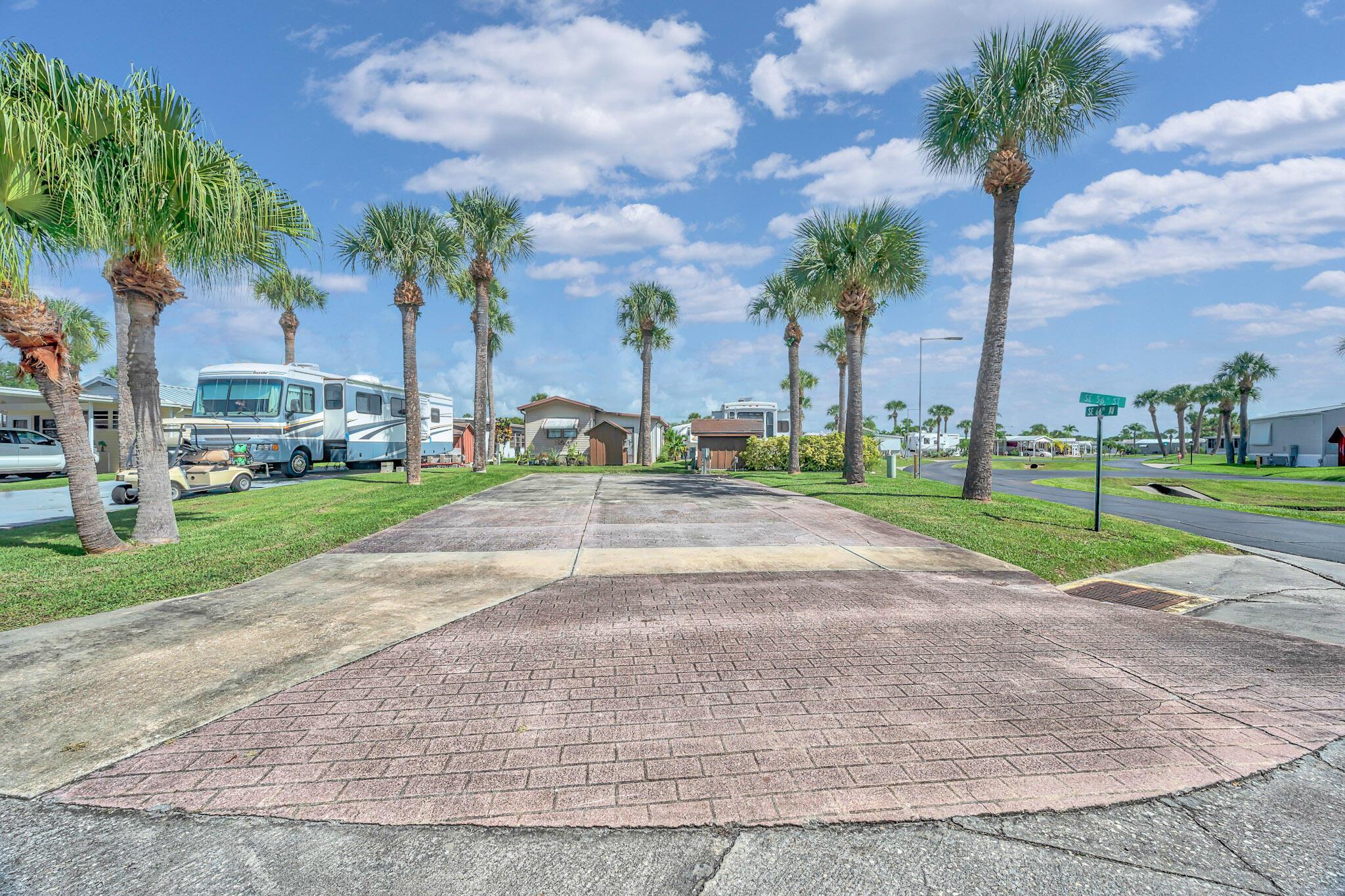 Discover Your Slice of Paradise at Ancient Oaks - Prime Vacant Land in a Vibrant 55+ Community! Welcome to Ancient Oaks, a charming 55+ community that perfectly blends comfort, camaraderie, and convenience. Nestled on 40 picturesque acres along the north shore of the stunning Lake Okeechobee, this captivating neighborhood is home to a thriving community of 686 units that share a passion for enjoying life to the fullest. Your Future Awaits: Ideal Lot for RV, 5th Wheel, Pull out Camper or Mobile Home! Picture yourself in a serene getaway where your dreams of a retirement lifestyle come to life! This prime vacant land offers a rare opportunity to park your RV, 5th wheel, or mobile home, with all the essential utilities - water, sewer, and electricity - readily available for hookup.