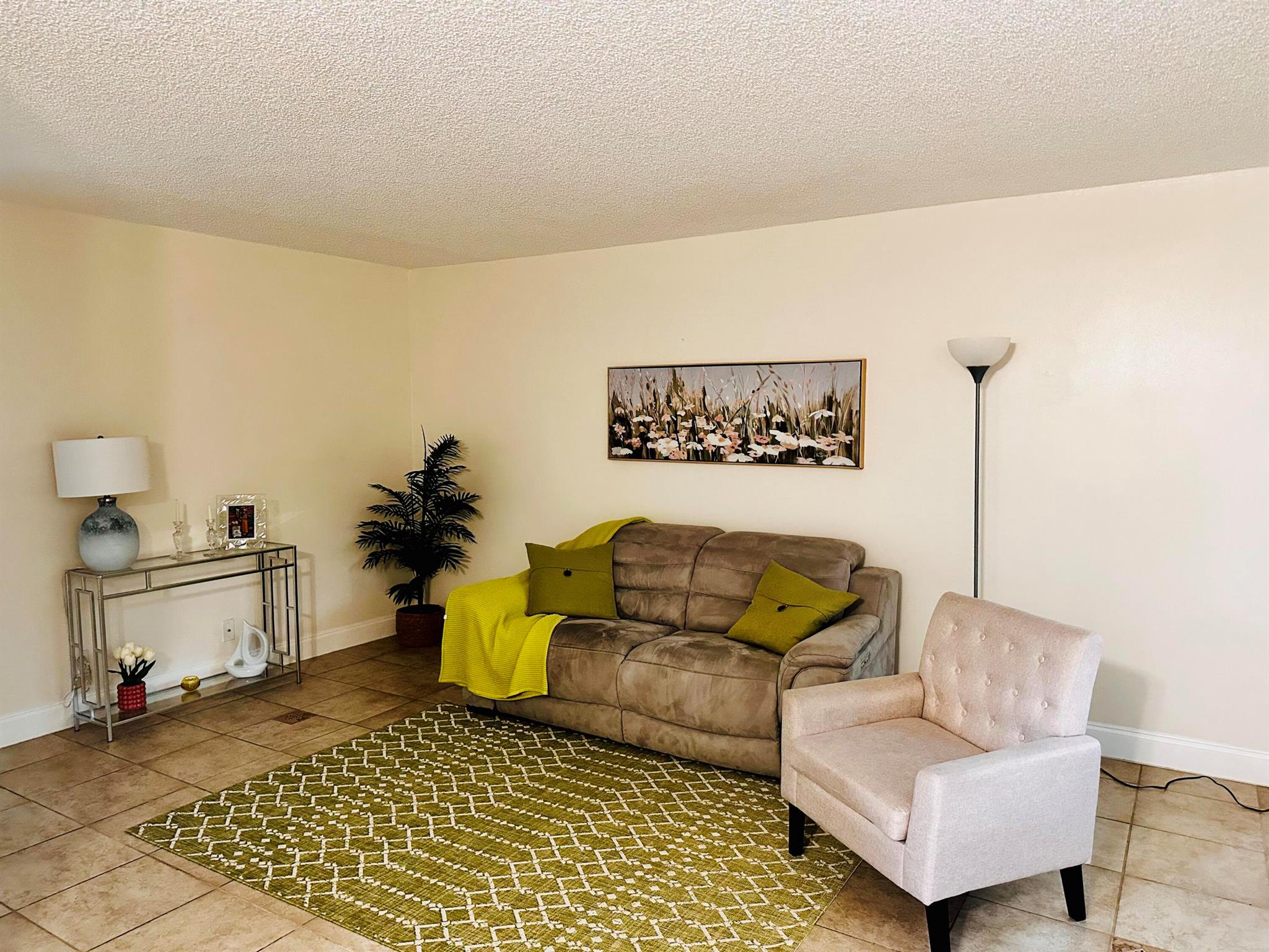 Charming 2-Bed/1.5-Bath First-Floor Corner Unit in 55 plus Community, Only One Owner Needs to Be 55!Welcome to this beautifully updated and move-in ready corner unit, offering comfort, convenience, and a vibrant lifestyle. This light-filled 2-bedroom, 1.5-bathroom home features a spacious kitchen with a charming lookout window, perfect for entertaining or enjoying a quiet morning coffee. The home has been freshly painted and includes new bathrooms, a new kitchen sink and faucet, and newer appliances. Stay cool year-round with a newer central A/C system.Conveniently located on the first floor with a laundry facility on the same floor, this unit also comes with one assigned parking space and plenty of guest parking.