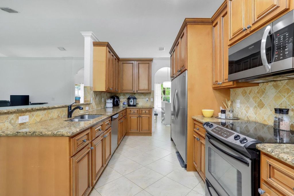 Photo of 1273 SW Granville Avenue, Port Saint Lucie, FL 34953 (MLS # R10995329)