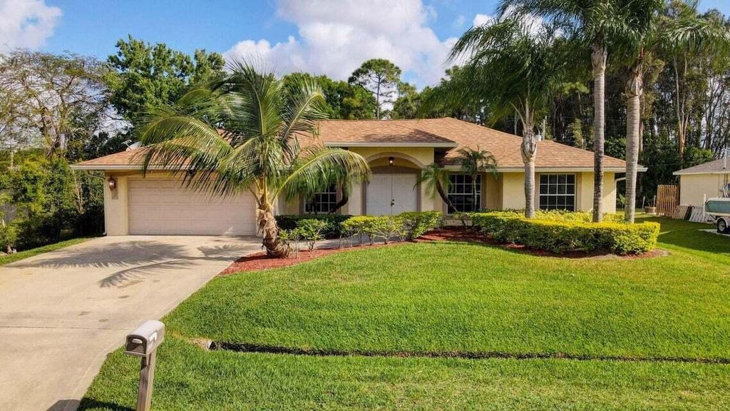 Photo of 1273 SW Granville Avenue, Port Saint Lucie, FL 34953 (MLS # R10995329)