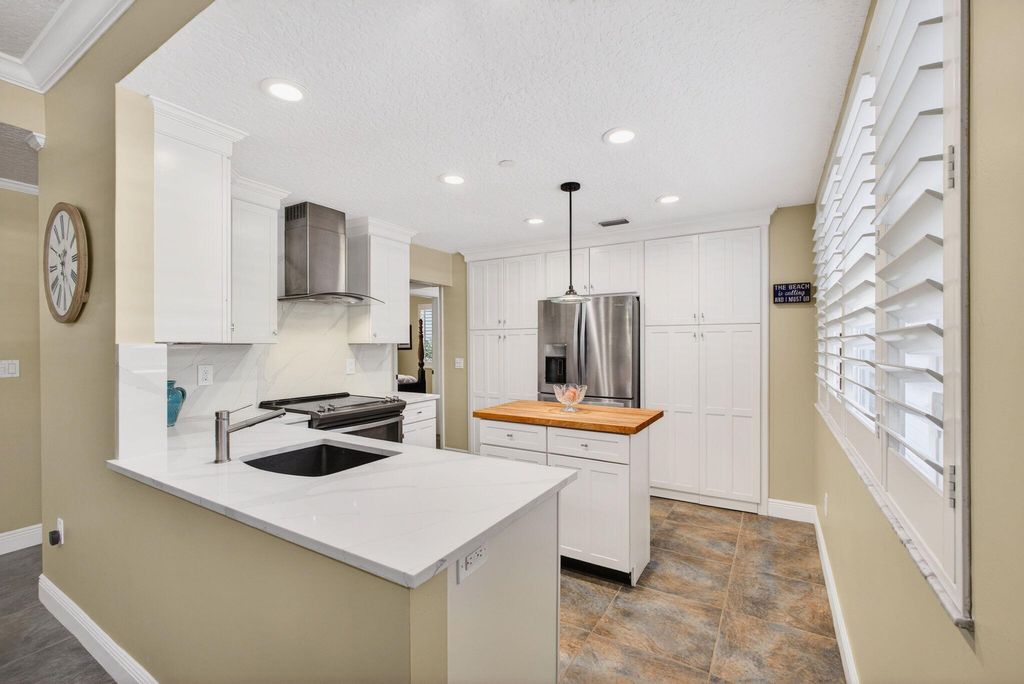 Photo of 911 Oak Harbour Drive, Juno Beach, FL 33408 (MLS # R11169735)