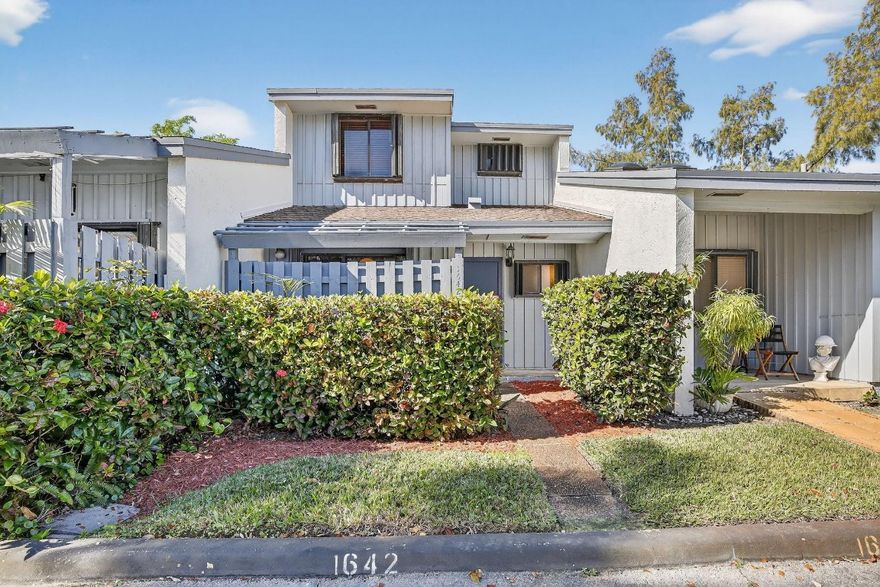 Move-in ready home located in a gated community with no rental waiting period. This residence features a newer A/C, a 5-year-old roof with the assessment paid in full, and an impact-rated skylight for added natural light and storm protection. Accordion shutters provide full hurricane coverage. The washer and dryer are conveniently located downstairs. The primary suite offers two walk-in closets and a private balcony. Enjoy a fenced back patio ideal for outdoor seating and entertaining. A great opportunity in a well-maintained, secure neighborhood close to shopping, dining, and major roads.