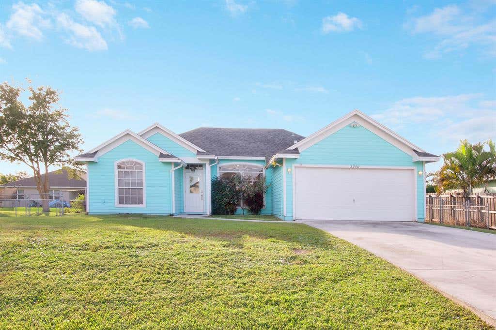 Photo of 3250 SW Crumpacker Street, Port Saint Lucie, FL 34953 (MLS # R10764036)