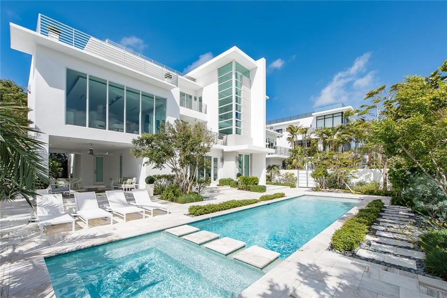 Ocean Views Across From The Beach! When the perfect house comes along, everyone takes notice. This is a custom 5,241 square foot home of artfully engineered design with a soaring three story entry foyer, first floor VIP suite, Media Room, 2 guest suites, formal Dining plus a large open air Dining terrace. The Chef's kitchen features all Miele appliances, gas cooking and a sizable island. A shoji wall allows formal or informal use of the room. Every bedroom has walk-in closets, large baths with duo sinks and access to an outdoor space. Other features include an elevator, 3-space garage, 2,346 SF of terraces and balconies, a rooftop terrace with Ocean views perfect for star gazing. Also, a whole house generator, a resort-quality pool and spa and gated motor court with room for several cars. Constructed new in 2014 as a second home and available now available for the first time. Sans Souci means "Without Worry or Carefree". Perfectly built to capture light and views! There is a Great room with a gas fed fireplace, floating ceiling and walls of glass. Floor 3 hosts the Master quarters and owner's Den.  Ambient lighting sets the mood throughout the home. This is what happens when a world class interior designer and a renowned architect are teamed with an outstanding home builder from the start.