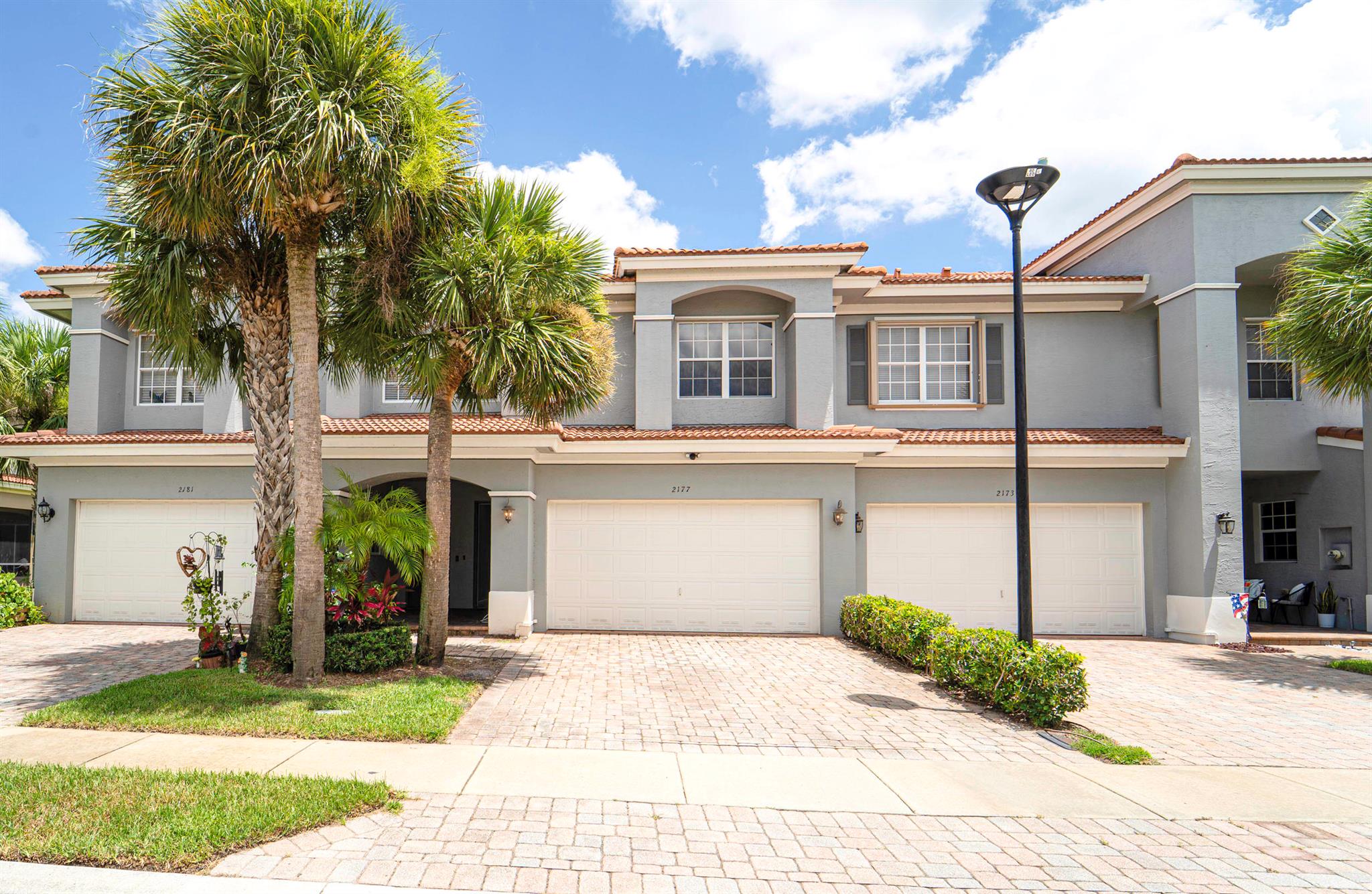 Welcome to this adorable and quiet townhouse, located in the desirable gated community of Newport Isles. This well maintained home offers a perfect blend of comfort, space, and convenience. This home is 3 bedrooms, 2.5 bathrooms, and has an open-concept layout with tile and carpet flooring throughout. Enjoy the serene lake views from your screened-in lanai or entertain guests in the spacious living and dining areas. The community offers resort-style amenities including two pools, a clubhouse, fitness center, tennis courts, playgrounds, and walking paths. Ideally located just minutes from the vibrant Tradition area, you'll enjoy quick access to shopping, dining, entertainment, and I-95, making commuting and weekend outings a breeze. This home truly offers the best