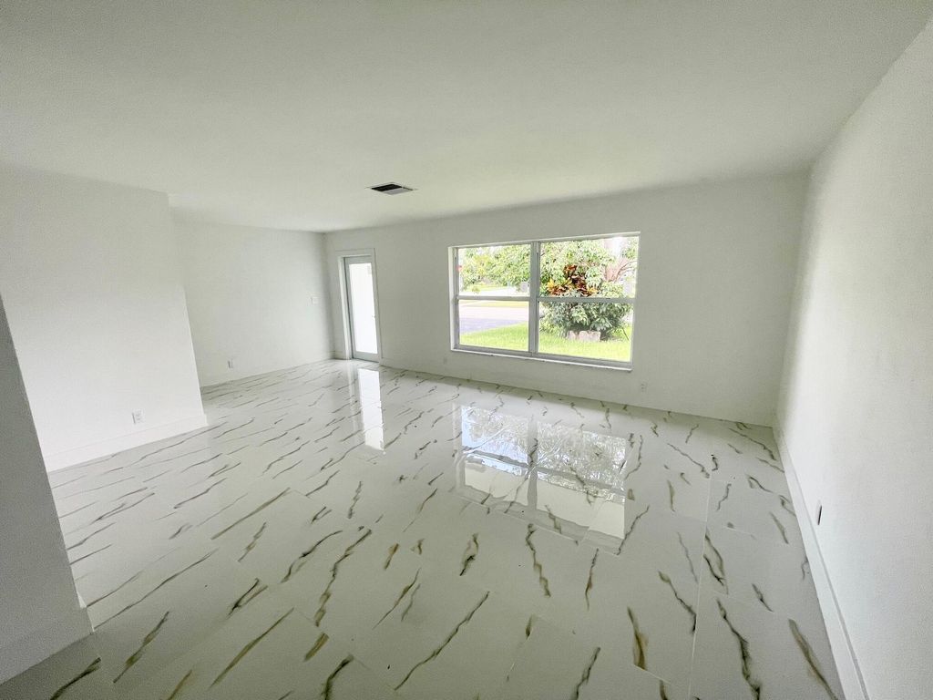Photo of 6606 NW 95th Avenue, Tamarac, FL 33321 (MLS # B26045407)