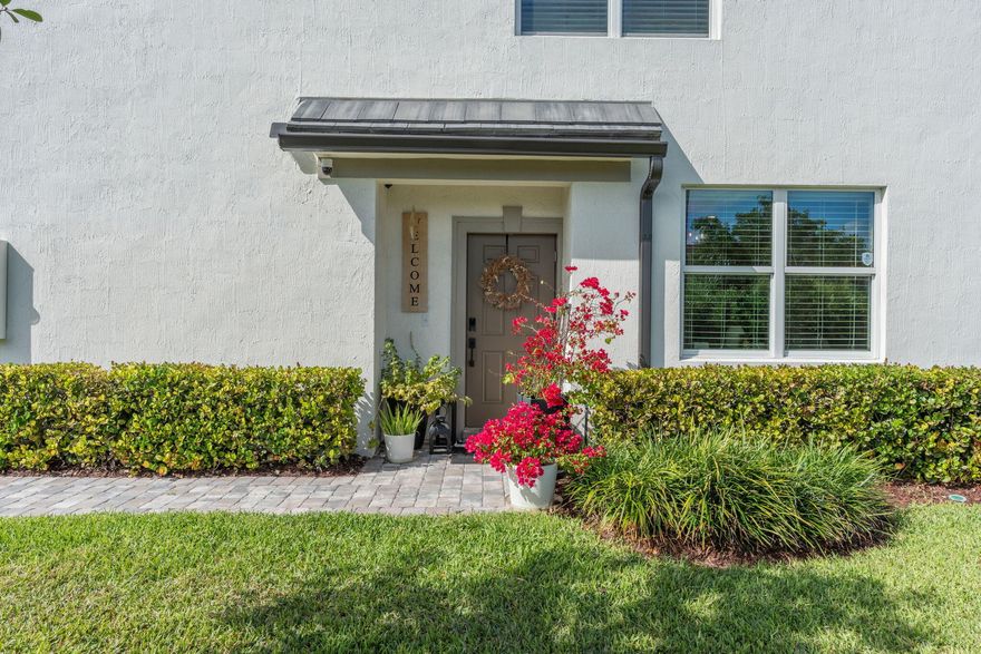 New community in 2024, gated community, loft style family room, 4 additional parking spaces adjacent to the property,  park-like green space adjacent  to the property, may be sold furnished if desired, home warranty from builder for 8 more years, energy efficient HVAC system, 10 minutes distance from I-95 and turnpike, executive airport, impact windows and doors throughout, neutral colors throughout the home, fiber internet included with the HOA, long walking track and green space around the lake,  pet friendly community, security system in place, 16 inch neutral ceramic tile.