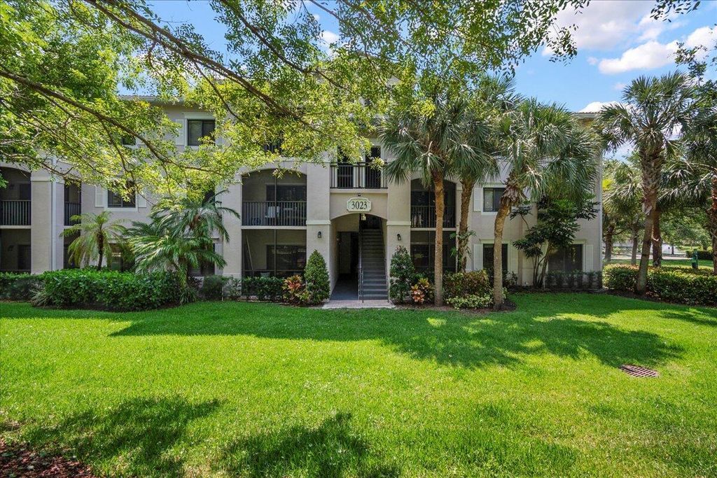 Photo of 3023 Alcazar Place #103, Palm Beach Gardens, FL 33410 (MLS # R10991603)