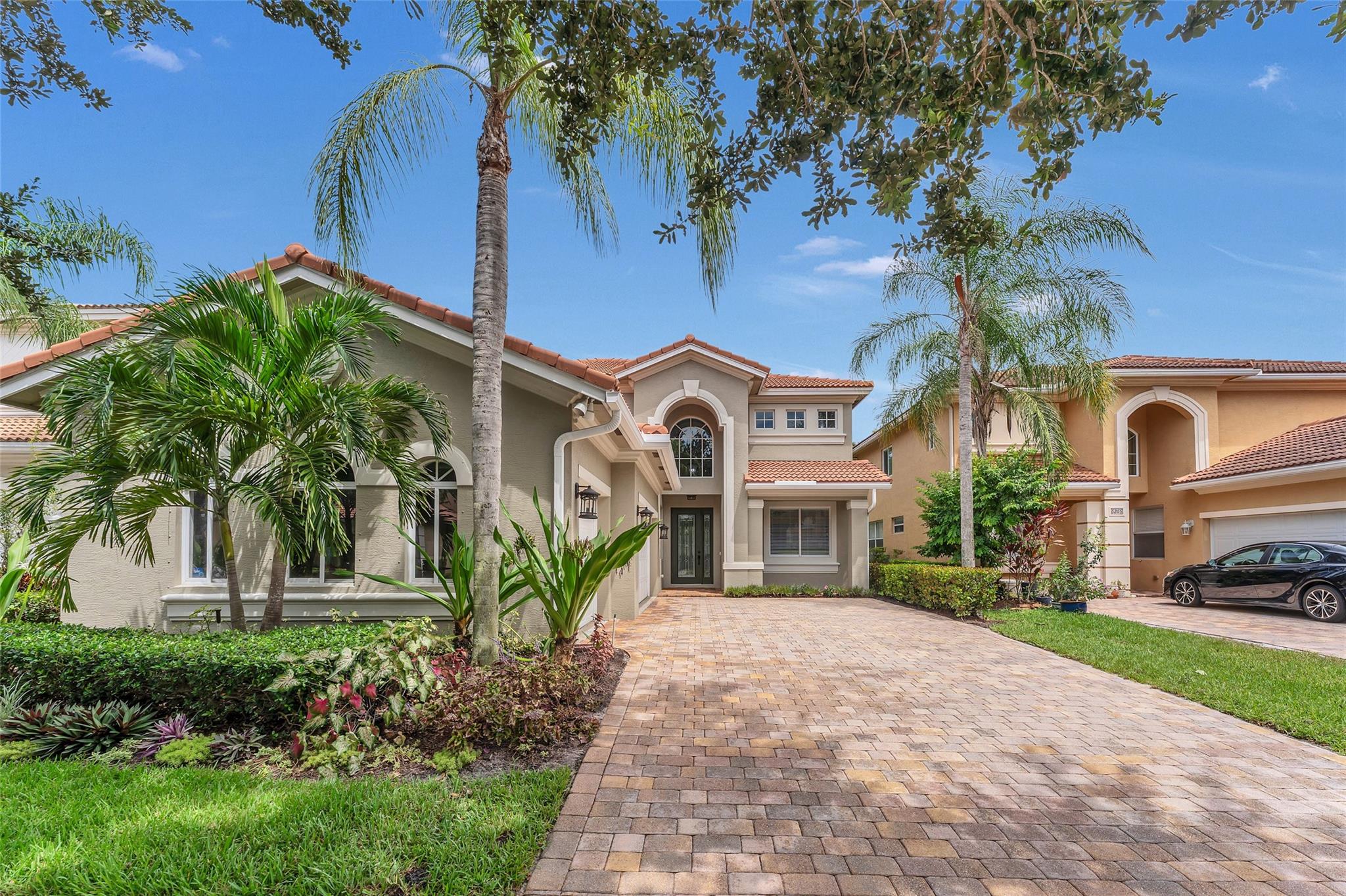 This stunning 5-bedroom, 3-bathroom residence features a spacious 3-car garage in a vibrant community with resort-style amenities. Enjoy a gated entry, a pool, clubhouse, fitness center, tennis courts, and nature trails—all included in the HOA! Perfectly located, the home abuts the main lake and walking trail, just 50 yards from the clubhouse and pool, with easy access to I-95 and the Turnpike. Recent upgrades include a one-year-old hot water heater, updated master bath, A/C warranty through 2026, & interior has been freshly painted. Small portable emergency generator instslled last year. Relax in the reading alcove on the second floor or utilize two attic storage areas. With top-rated schools nearby, this exceptional property offers luxury, space, and an unbeatable location!