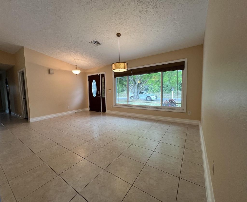 Photo of 682 SE Delancey Lane, Port Saint Lucie, FL 34984 (MLS # R10960045)