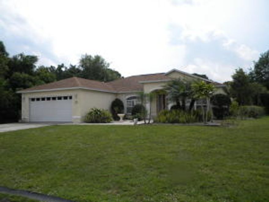 Beautiful and spectacular 4/3/2 pool home on oversized corner lot, close to half an acre of land.  This home has it all, formal living, dining, family room; tiled living areas, Berber carpet in bedrooms, stainless steel appliance package, granite counter tops, plantation shutters, accordion hurricane shutters, lush landscaping oversized porch with pool cage.  A small paradise  ... and so much to offer!