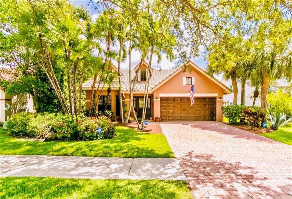 Photo of 6310 NW 58th Way, Parkland, FL 33067 (MLS # F10295279)