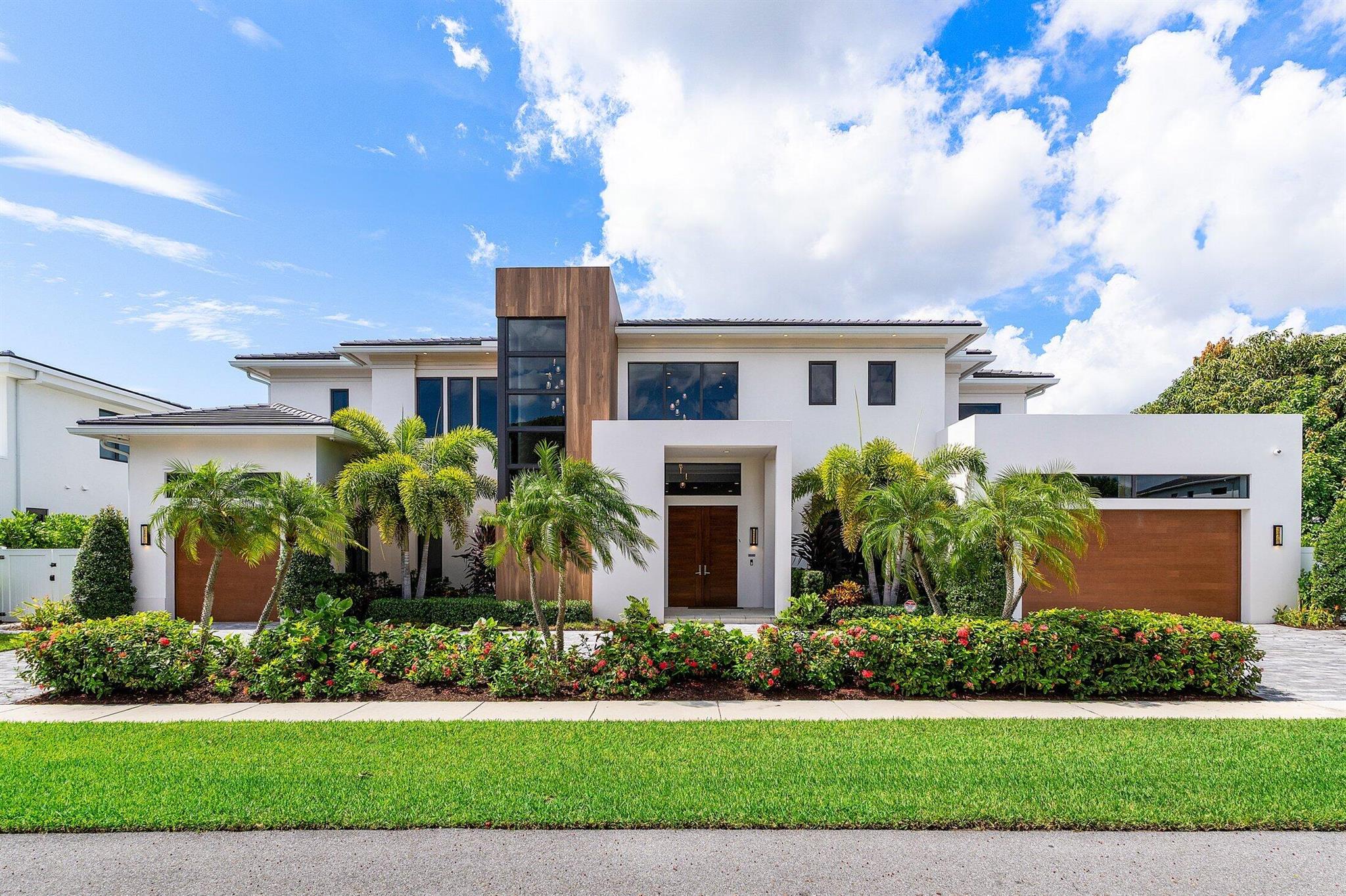 Spectacular Contemporary Living in Boca Villas. Crafted by renowned Primo Construction, this magnificent contemporary estate is ideally situated in the prestigious Boca Villas neighborhood--just steps from the ocean and moments from The Boca Raton, Mizner Park, Royal Palm Plaza, and East Boca Raton's finest restaurants and shops. This two-story, 5-bedroom, 6.5 bath residence offers a seamless blend of sophisticated design and luxurious comfort. Each bedroom has en suite baths. The second floor boasts a primary bedroom and 3 secondary bedrooms. The open concept living area features soaring ceilings, a sleek modern glass stairwell, and a gourmet chef's kitchen; all anchored by a decorative remote-control fireplace that adds both warmth and elegance.