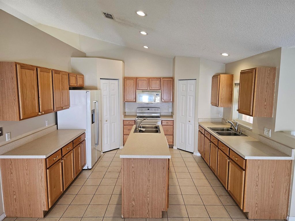 Photo of 2510 SW Chestnut Lane, Port Saint Lucie, FL 34953 (MLS # R11125137)