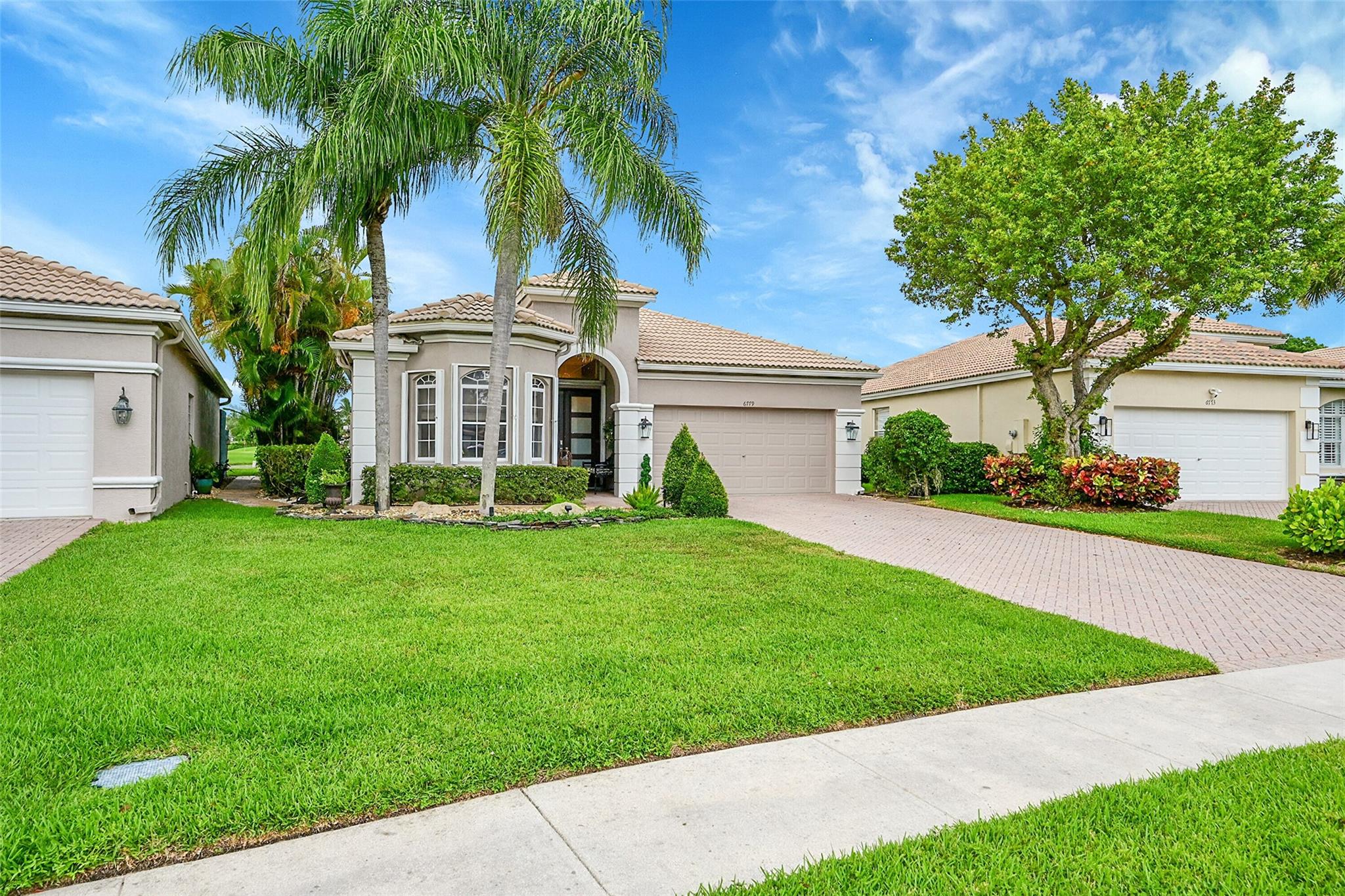 Live a fabulous lifestyle in Aberdeen Golf & Country Club. Home was totally remodeled with high end appointments making this an ideal house for your most discriminating buyers. Beautiful lake view from the huge Lanai, Duel electric FPL between dining room & den, crown moulding throughout w/ beautiful woodlike ceramic tile in entire house, tray ceiling in master bedroom, bathrooms are fabulous with tower showers & french doors leading out to a huge screened in lanai with a water fountain. Finishing off this beautiful house are outdoor lights & complete hurricane shutters. This is a beauty! Aberdeen offers restaurants, bar & lounge w/happy hour daily, fabulous fitness center with classes of every type, 3 pools plus a whirlpool, golf course, tennis, pickleball, bocce, putting green.