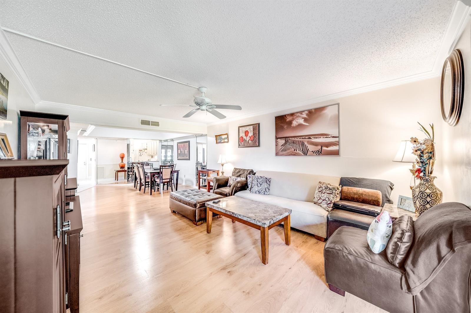 Bright And Spacious 2 Bed/2 Bath condo in prestigious community of Pines of Boca Barwood. This corner unit is larger in size and has extra windows offering more natural lighting. All with storm shutters. Features an eat in kitchen with large open living room. Spacious split bedrooms. Large walk-in closet in primary bedroom. Full size Washer/Dryer inside the Unit. Only steps away from the beautiful community pool. Enjoy Lush landscaping views. Convenient doors in the back. 55+ Active Adult Community Offers Pool, Tennis Courts, Large Clubhouse, Gym, Library, Billiard Room And More. Covered parking space. Pets up to 20lb are allowed. Easy to show !!