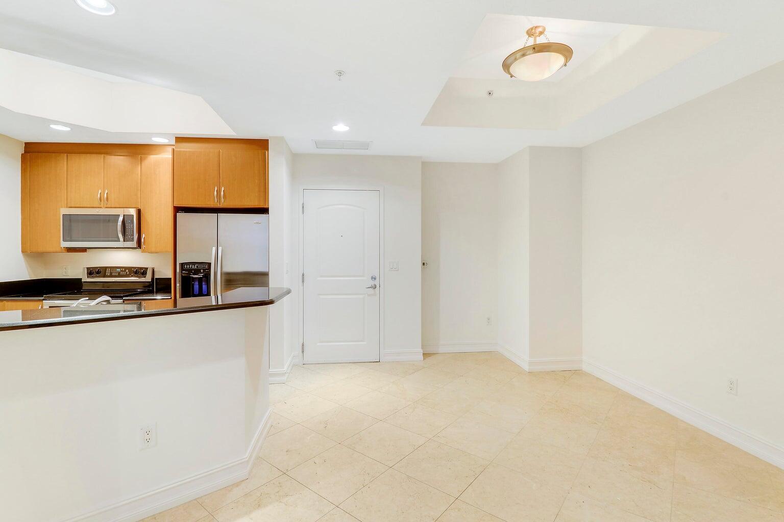 Spanning approximately 1,170 sq. ft., the home features sleek tile flooring throughout, a sun-drenched open-concept living space, and a chef's kitchen outfitted with granite countertops, stainless steel appliances, and generous cabinetry. The private balcony overlooks the beautifully landscaped courtyard, offering a tranquil escape just moments from the city's energy.The spacious primary suite is a peaceful retreat with a spa-style en-suite bath and a walk-in shower with modern finishes. The second bedroom provides flexibility--ideal as a guest suite, office, or personal gym. Two City Plaza sets the standard for luxury amenities: enjoy a rooftop pool and spa with breathtaking views, indoor and outdoor movie theaters, a fitness center, sauna, steam room, 24-hour security, and concierge.